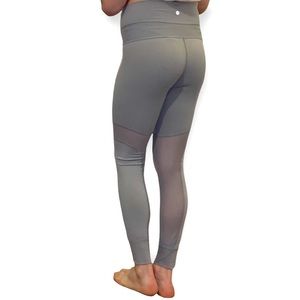 High-waisted Lululemon grey leggings with mesh cutouts